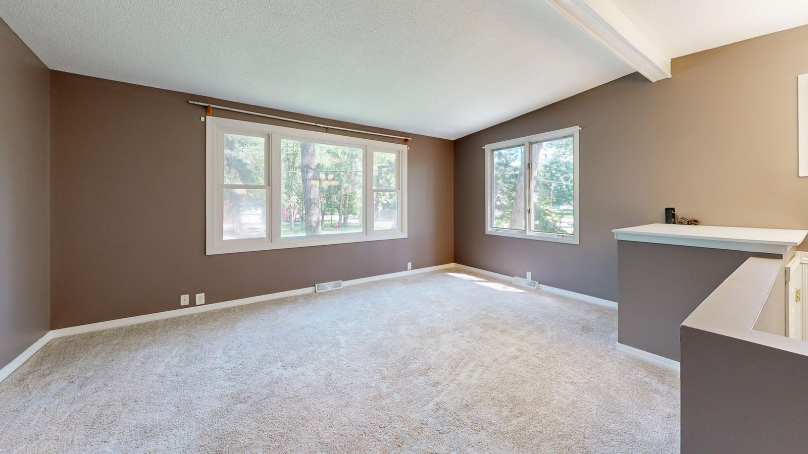 A bright, empty living room after an estate cleanout.